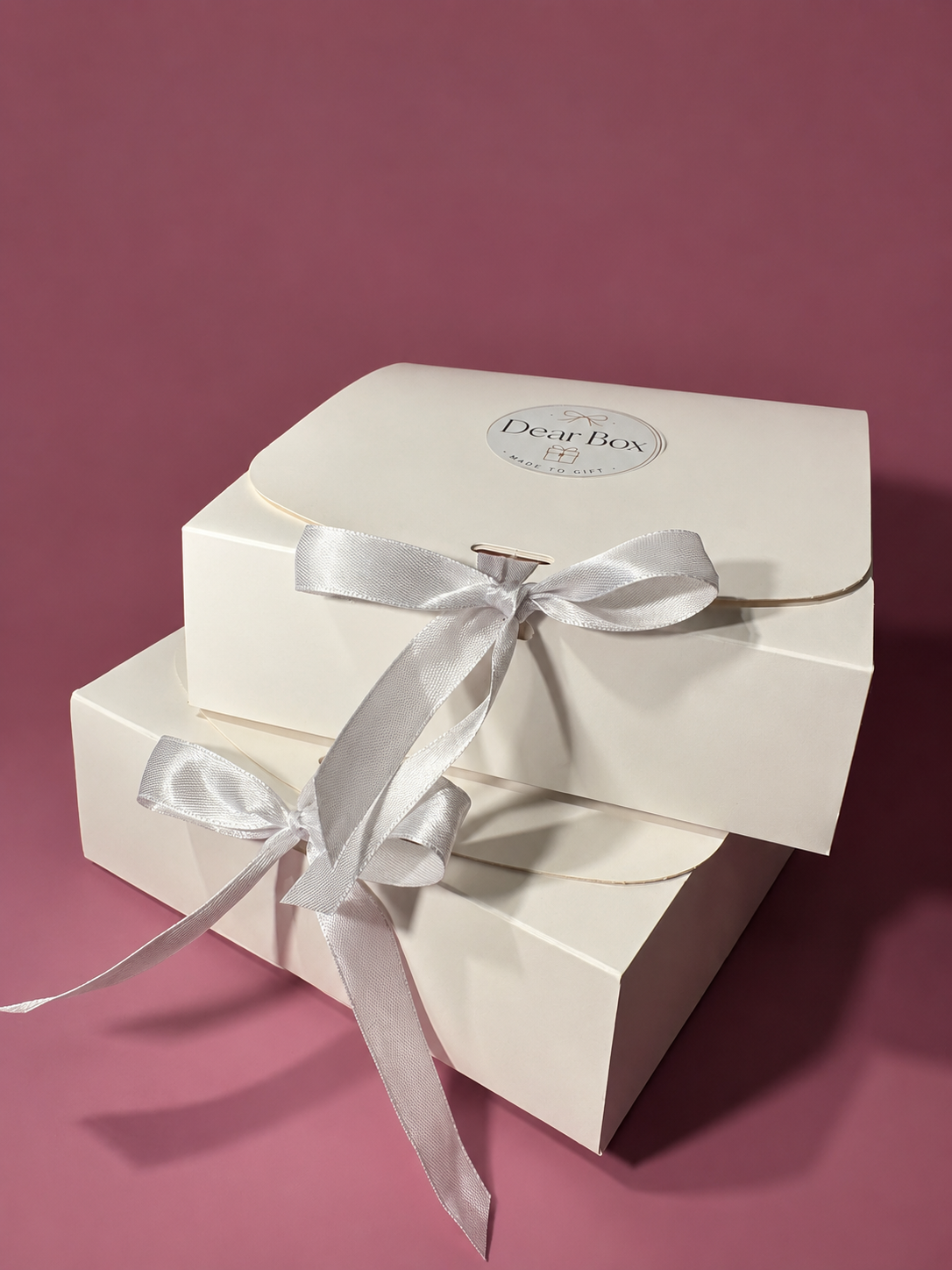 Dear Box gift boxes stacked with white ribbons